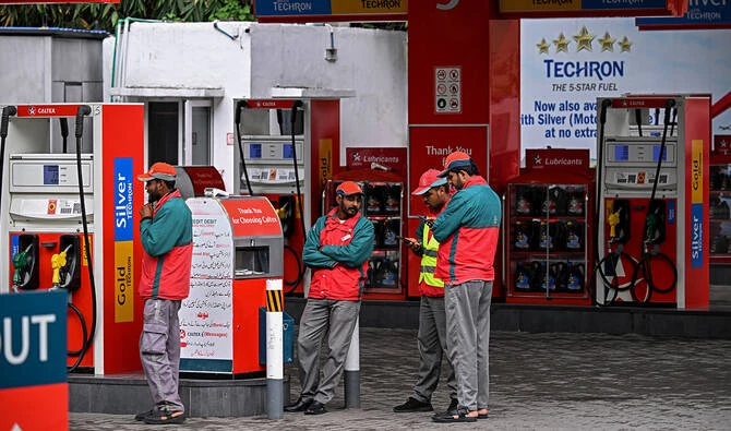 Workers wait for customers at a fuel station in Islamabad, Pakistan, on April 3, 2026. (AFP/File)