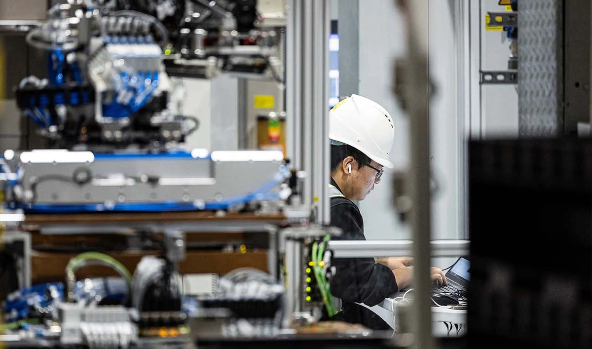 A Chinese operator works at the factory of the manufacturer of lithium ion batteries for electric vehicles AESC (Automotive Energy Supply Corporation), in Lambres-lez-Douai, northern France, on November 13, 2025. (AFP/ file)