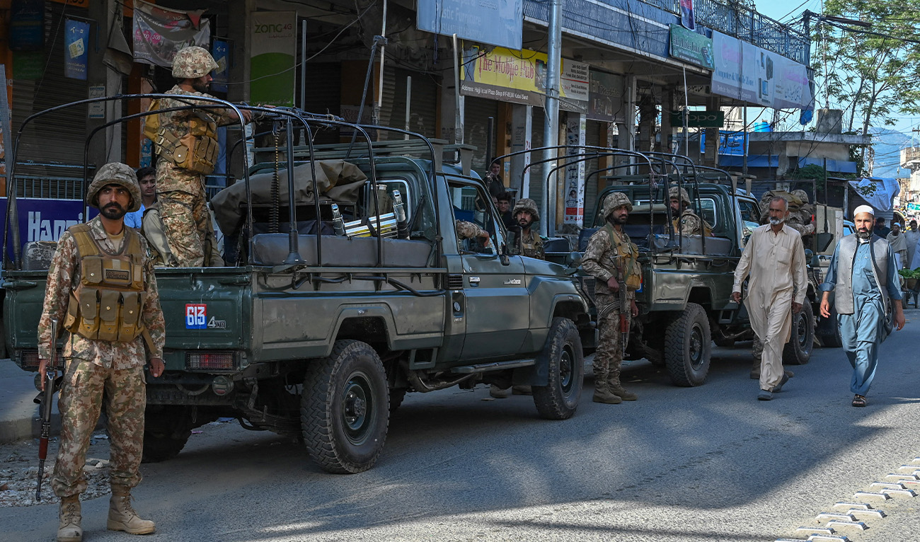 Army troops stand stand guard along a street in Kabal town of Swat Valley in Pakistan’s northwestern region of Khyber Pakhtunkhwa province on April 25, 2023. (AFP/File)