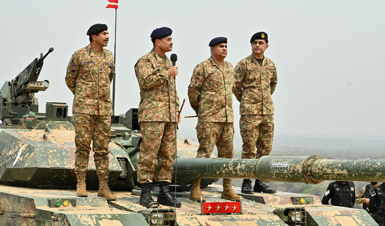 Chief of Army Staff of Pakistan Asim Munir holds a microphone during his visit at the Tilla Field Firing Ranges (TFFR) to witness the Exercise Hammer Strike, a high-intensity field training exercise conducted by the Pakistan Army's Mangla Strike Corps, in Mangla, Pakistan May 1, 2025. (Reuters/File)