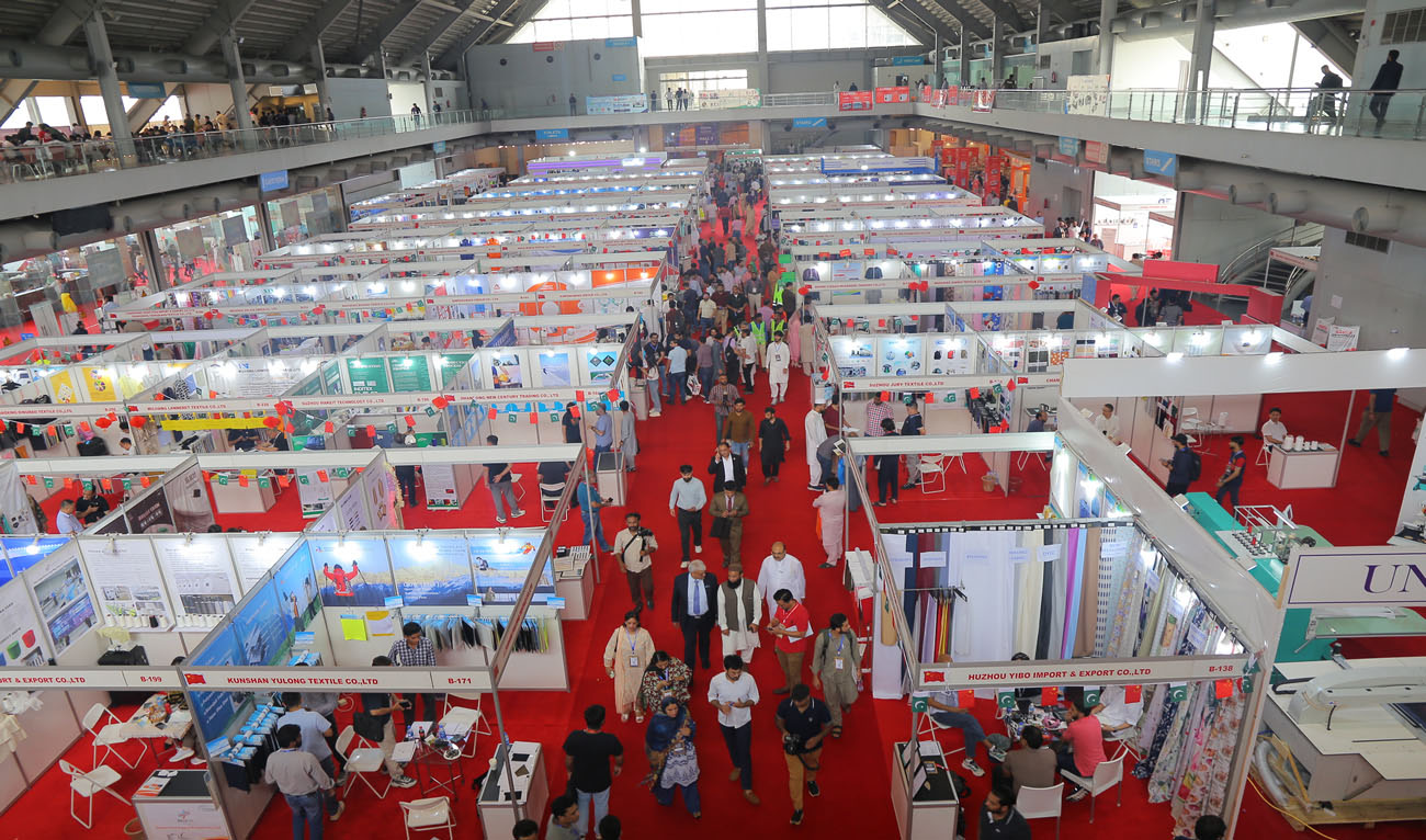 A general view of visitors walking through exhibition booths inside a large exhibition hall in Lahore, Pakistan, on July 4, 2026. (Pakistan Expo Centres/X)