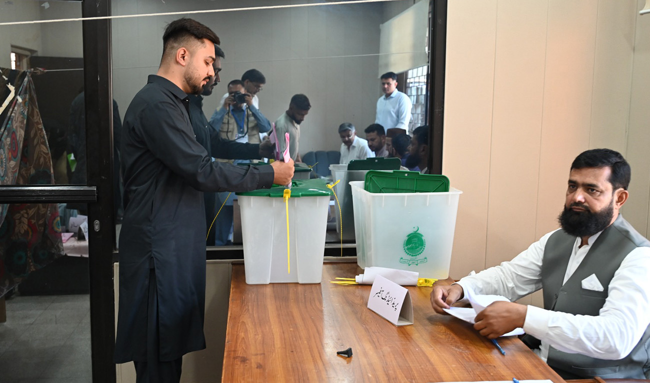 A voter casts his ballot at a polling station during the first phase of general elections in Azad Kashmir's Mirpur division on July 27, 2026. (AJK Election commission)