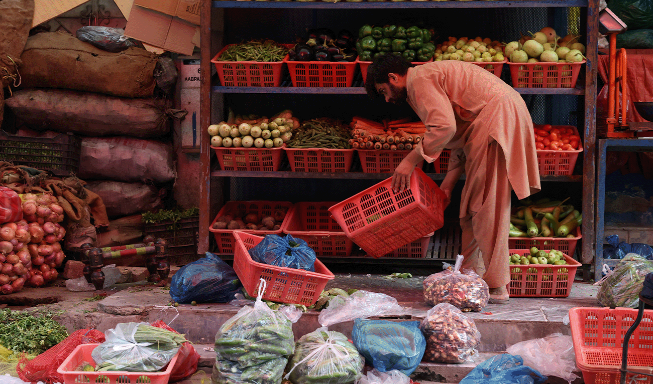 A vendor sorts vegetables while setting up a stall at a market in Islamabad, Pakistan June 15, 2026. (Reuters/File)