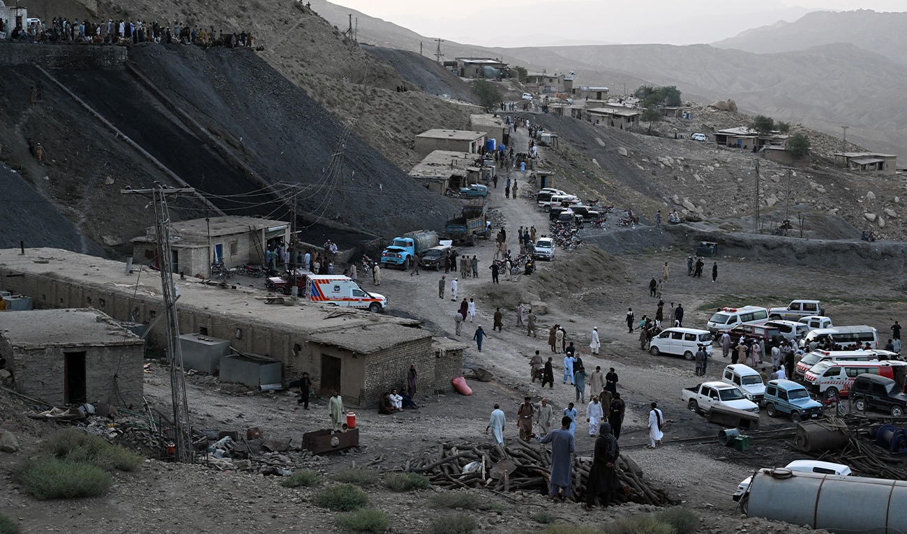 Coal miners and relatives gather after a coal mine collapsed in the Surange area, some 50 kilometres east of Quetta, Pakistan, on July 30, 2026. (AFP)
