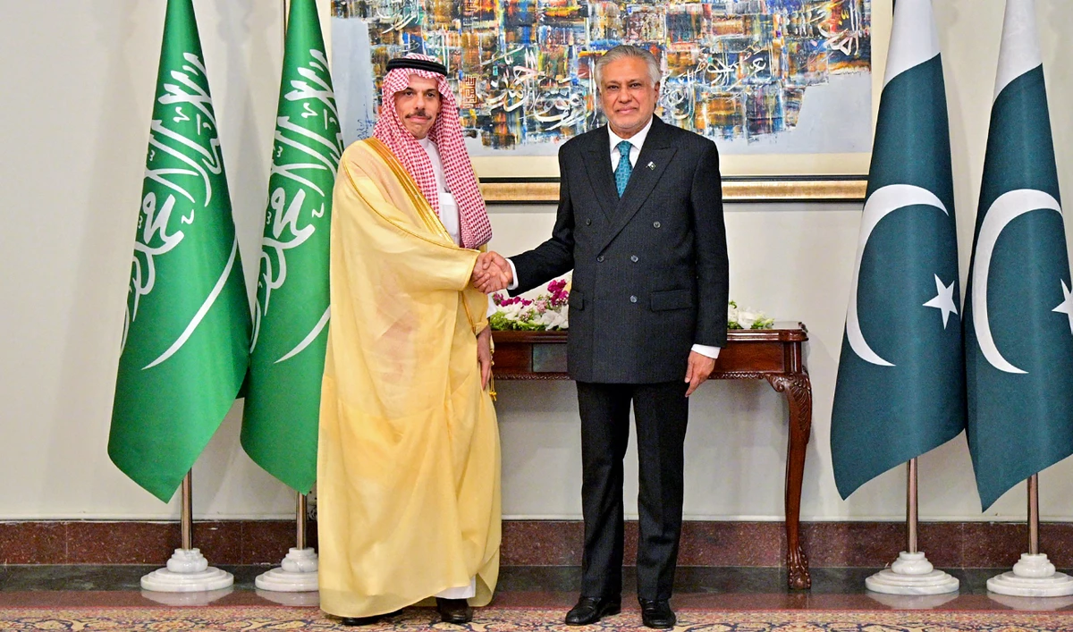 Pakistan’s Foreign Minister Ishaq Dar shaking hands with his Saudi Arabian counterpart Prince Faisal bin Farhan (left), at the Foreign Ministry office in Islamabad, Pakistan, on March 29, 2026. (AFP/MOFA/File)