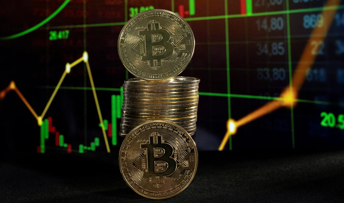 Bitcoin tokens and a price chart are seen in this illustration picture taken on November 21, 2024. (REUTERS/File)
