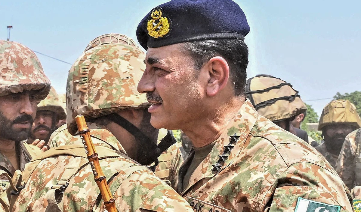 This handout photograph taken on May 14, 2025, and released by Pakistan's Inter Services Public Relations (ISPR) shows Pakistan’s Army Chief General Syed Asim Munir (R) meeting with army personnel during his visit with the country’s Prime Minister Shehbaz Sharif at Pasrur Cantonment in Sialkot, Punjab province. (AFP/ file)