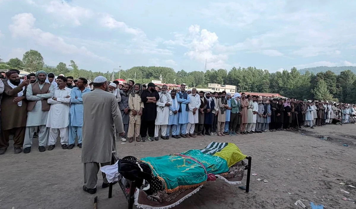 People attend the funeral of protester Khawaja Zargham Ali, who was killed in clashes in Rawalakot on July 27, at the Eidgah ground on the outskirts of Rawalakot, Azad Kashmir, on July 28, 2026. (JAAC)