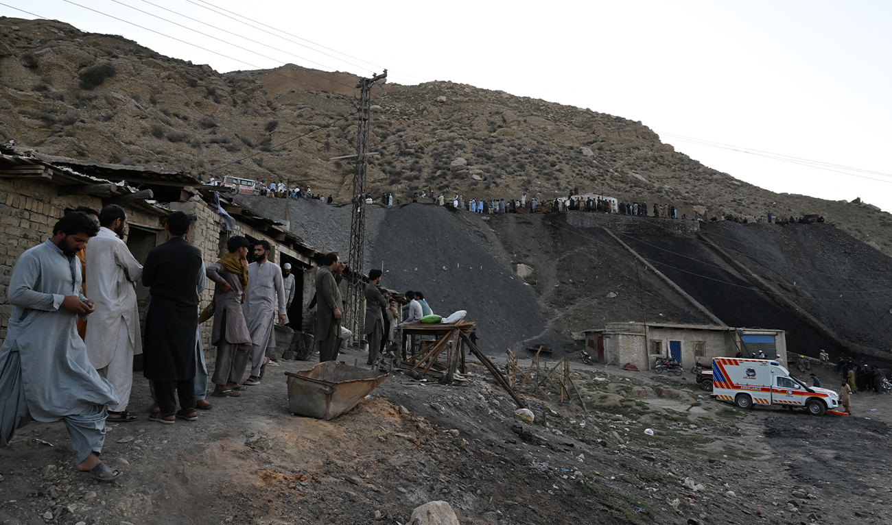 Coal miners and relatives gather after a coal mine collapsed in the Surange area, some 50 kilometres east of Quetta, Pakistan, on July 30, 2026. (AFP)