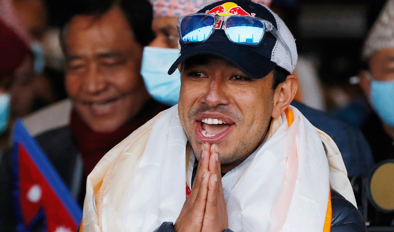 Nirmal Purja gestures at Tribhuwan International airport in Kathmandu, Nepal, January 26, 2021. (AP/File)