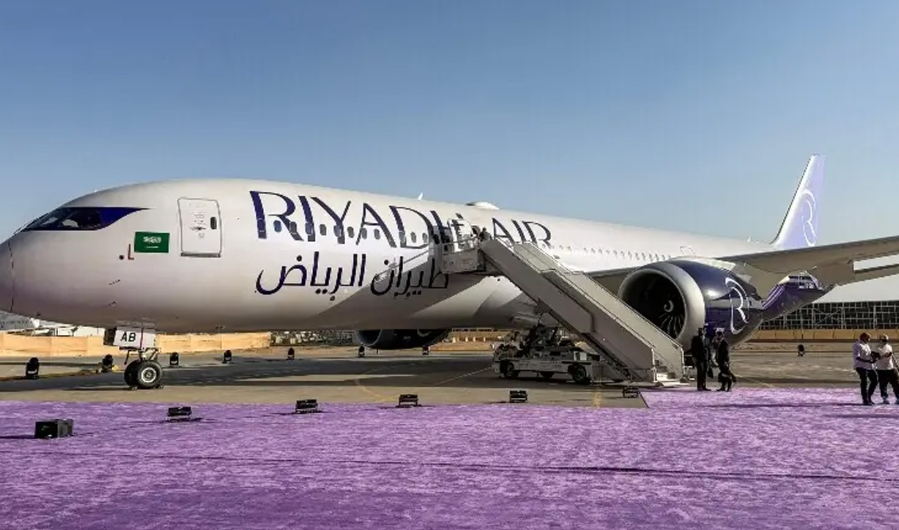 Hostesses stand inside a Boeing 787-9 Dreamliner aircraft of Saudi airline Riyadh Air at King Khalid International Airport in Riyadh on June 7, 2026. (AFP/File)