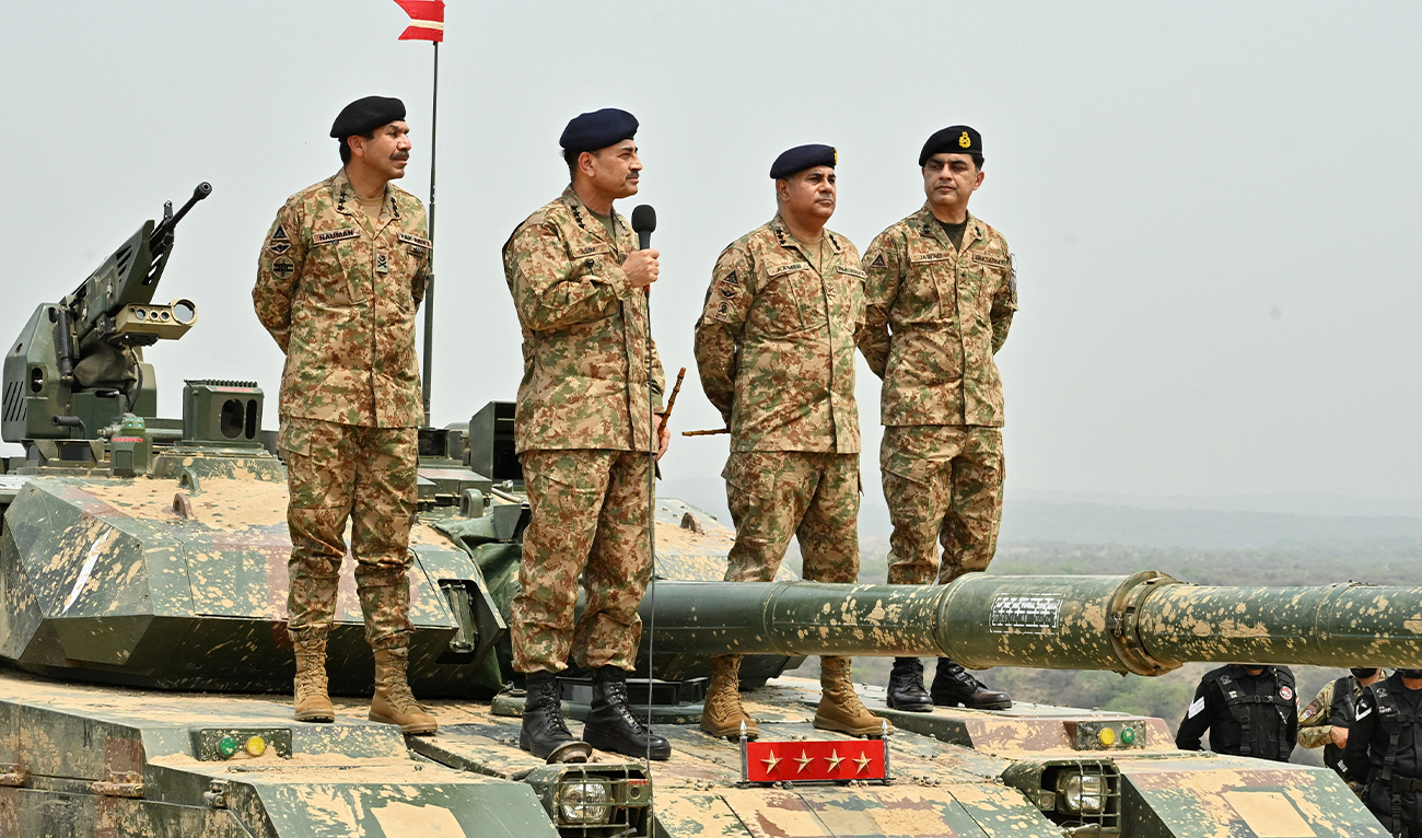 Chief of Army Staff of Pakistan Asim Munir holds a microphone during his visit at the Tilla Field Firing Ranges (TFFR) to witness the Exercise Hammer Strike, a high-intensity field training exercise conducted by the Pakistan Army's Mangla Strike Corps, in Mangla, Pakistan May 1, 2025. (AFP/ file)