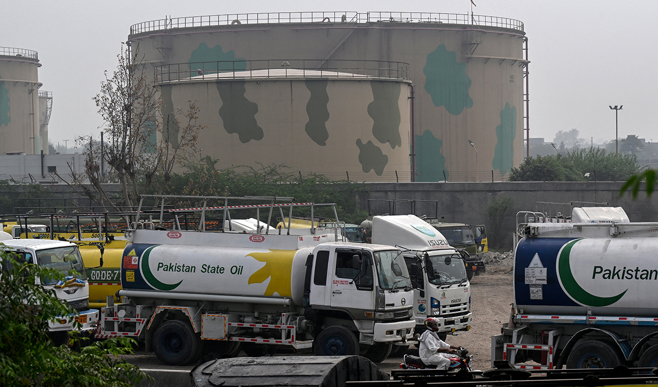 Pakistan State Oil tankers line up along a road before entering a fuel storage facility in Sheikhupura district near Lahore, Pakistan, on March 10, 2026. (AFP/File)
