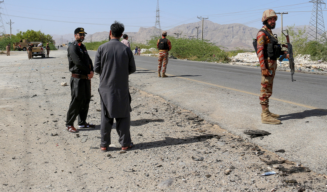 Security personnel stand guard at the site of a school bus bombing in Khuzdar district of Balochistan province on May 21, 2025. (AFP/ file)