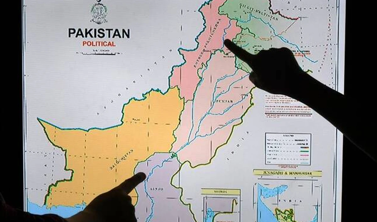 Journalists look at Pakistan's new political map on a screen at the Daily Metro Watch newspaper offices in Islamabad on August 4, 2020. (AFP/ file)