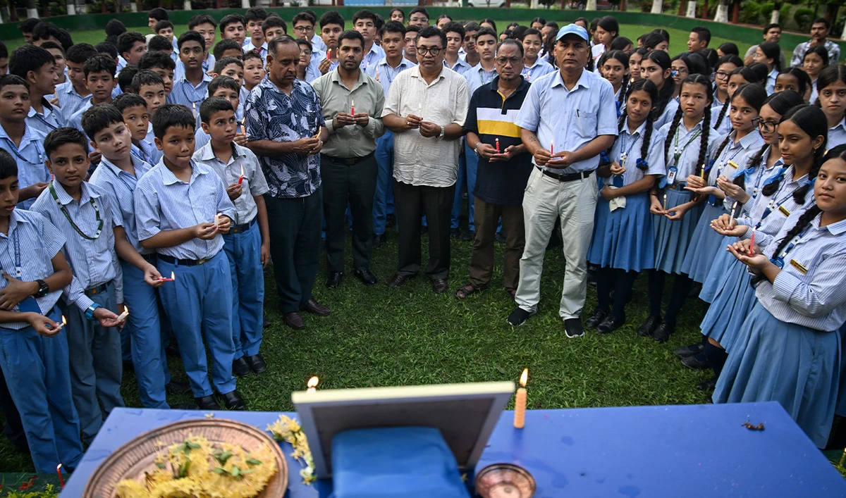 Mourners and students light candles to offer their condolences after the death of mountaineer Nirmal Purja and his companions in an avalanche in Pakistan, at Small Heaven School in Chitwan on August 2, 2026. (AFP)