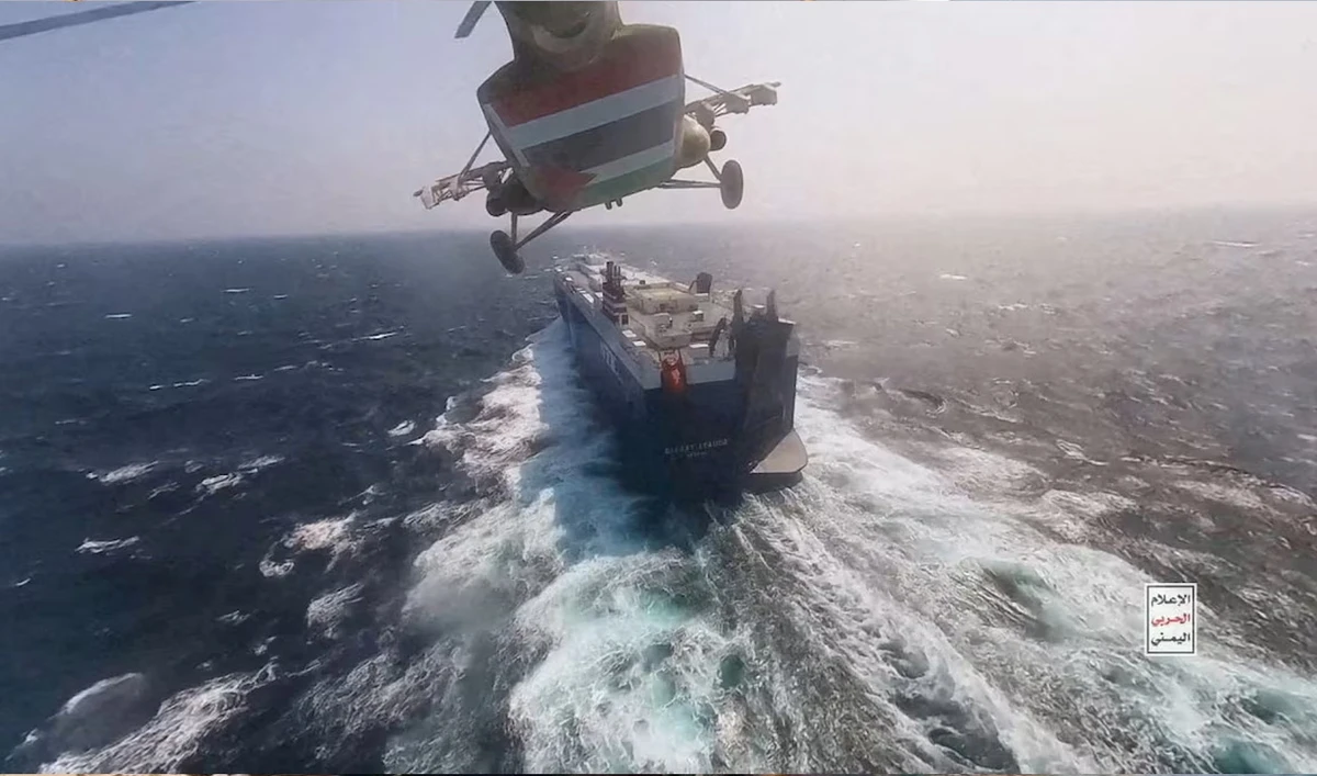 Houthi military helicopter flies over the Galaxy Leader cargo ship in the Red Sea in this photo released November 20, 2023. (Reuters/File)