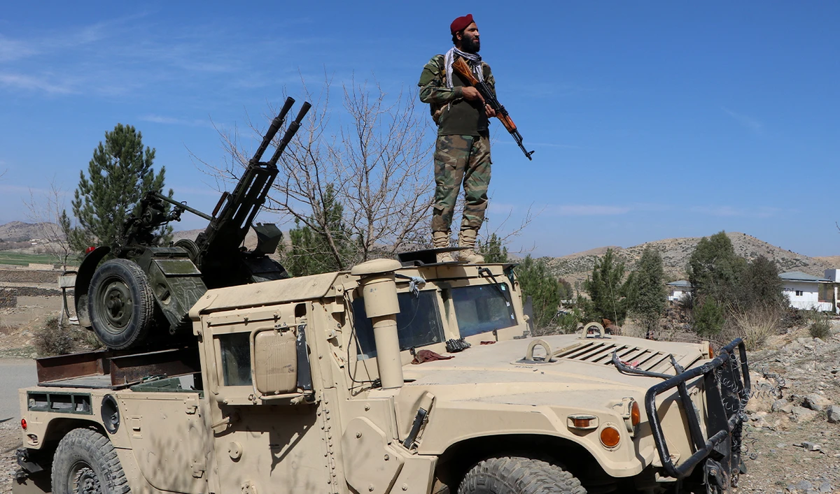 A Taliban security personnel stands guard near an anti-aircraft gun in the Tere Zayi district of Khost province, Afghanistan, on March 2, 2026. (AFP/File)