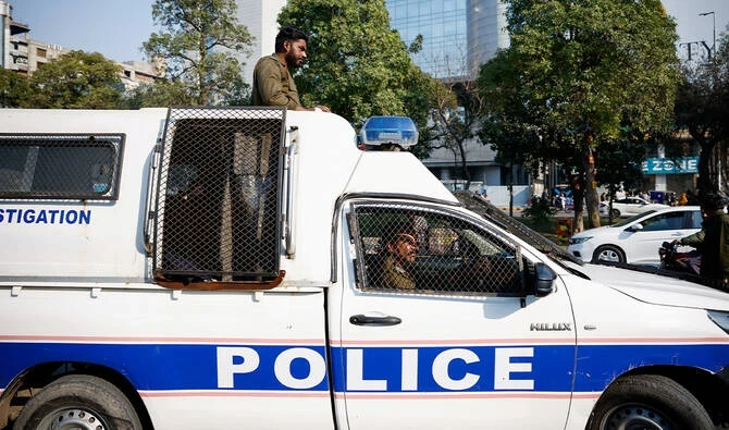 Police officers patrol during a protest in Lahore, Pakistan, on February 11, 2024. (Reuters/File)