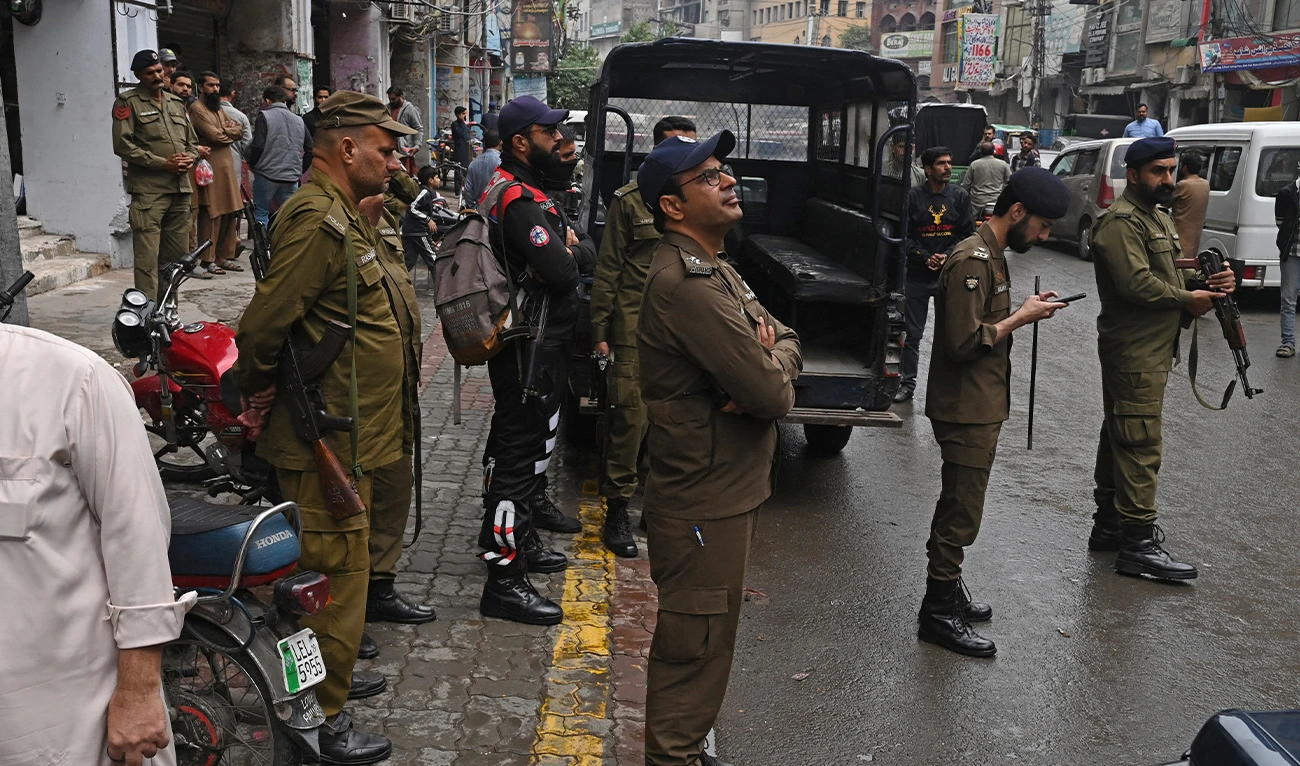 Police personnel patrol a market in Lahore on November 10, 2023 (AFP/File)