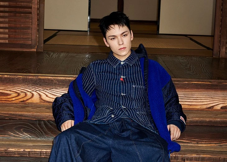 KENZO's first global ambassador VERNON, member of K-Pop group SEVENTEEN, wearing the straight denim jacket, priced at ¥113,300, as well as the 'KENZO Archive Logo' zip-up jacket, priced at ¥121,000, from the brand's new collection. (KENZO)