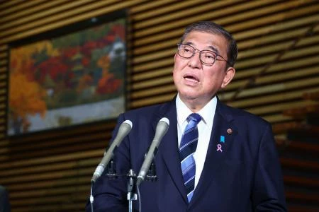 Japan's Prime Minister Shigeru Ishiba speaks to the media after the cabinet approved a comprehensive economic stimulus package, at the prime minister's office in Tokyo on November 22, 2024. (AFP)