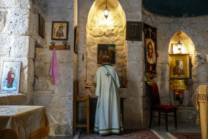 A priest holds Sunday Mass at the Greek Orthodox Convent of Saint Thecla in the town of Maaloula, Syria, Sunday Jan. 12, 2025. (AP)
