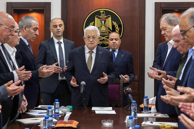 This handout picture released by the Palestinian Authority's Press Office (PPO) shows President Mahmud Abbas (C) leading prayers next to Palestine Liberation Organisation (PLO) Secretary General Hussein al-Sheikh (3rd-L) during a meeting of the organisation's Executive Committee in Ramallah on April 26, 2025. (AFP/Handout/PPO)