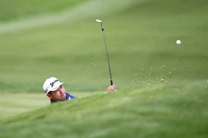 Japan’s Hideki Matsuyama chips onto the 12th green on the second day of the BMW PGA Championship at Wentworth Golf Club, south-west of London, on Friday. (AFP)