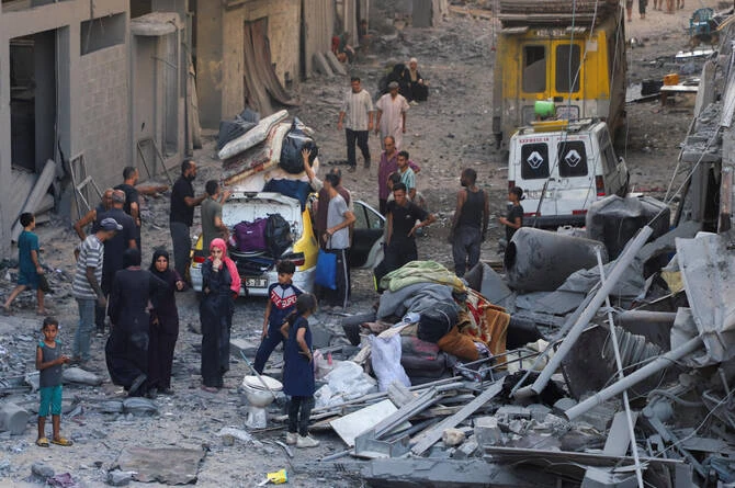 Palestinians inspect the site of an overnight Israeli strike on a house in Gaza City on Sept. 16, 2025. (Reuters)