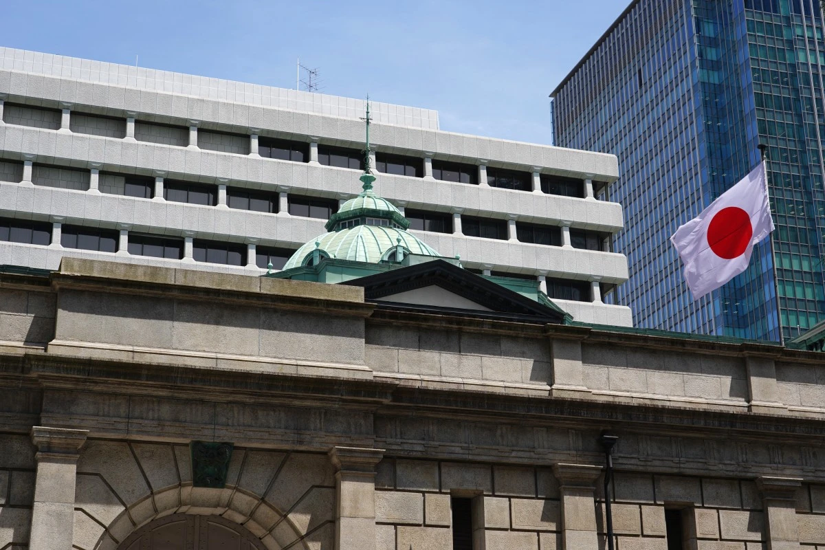 Japan's national flag flutters at the Bank of Japan headquarters building in Tokyo on June 16, 2026. (AFP)