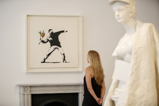 L'anonymat fait perdre à Banksy la marque déposée du «Lanceur de Fleurs»