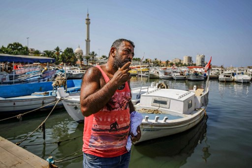 Khaled Abdallah, 47 ans, migrant libanais rapatrié de Chypre après une traversée clandestine avortée. Il se promet de recommencer. (Ibrahim Chalhoub/AFP)