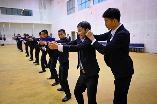 Costard, pistolet et cybersécurité: à l'école chinoise des gardes du corps