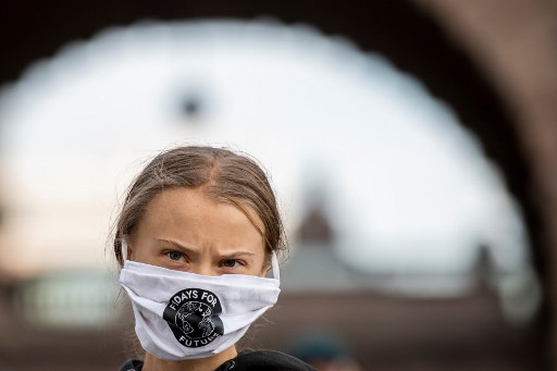 L’activiste pour le climat Greta Thunberg lors d’une manifestation « Fridays for Future » devant le Parlement suédois à Stockholm, le 25 décembre (Jonathan Nackstrand/AFP)