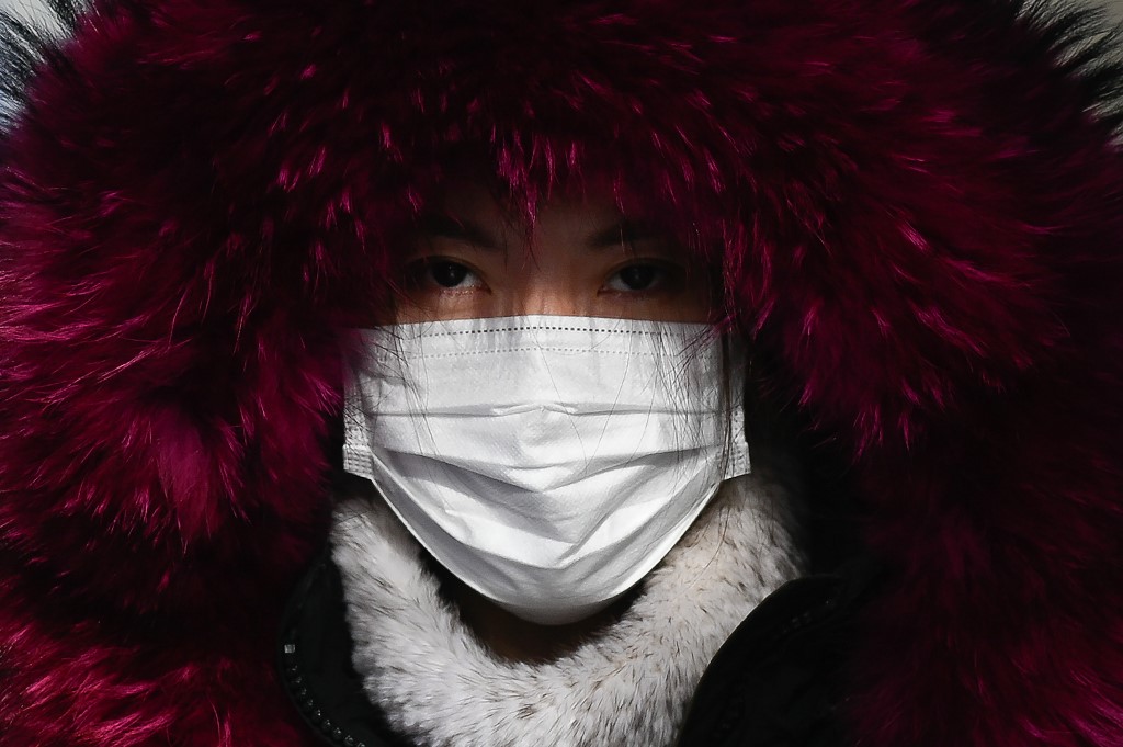 Covid-19: Pékin vante son succès «extraordinaire», avant une enquête de l'OMS