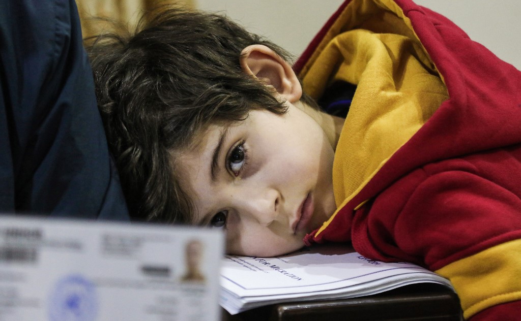 Jeune syrien secouru. (AFP)