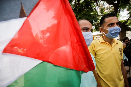 Virus: les Palestiniens commencent la vaccination en Cisjordanie occupée