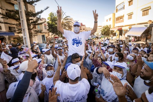 Les partisans du Parti Authenticité et Modernité (PAM) acclament leur candidat lors d'un rassemblement électoral à Rabat, le 4 septembre 2021, à quatre jours des élections législatives et locales (Photo, AFP)