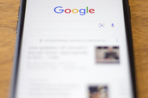 Le logo Google visible sur un téléphone à Washington, DC, le 10 juillet 2019 (Photo, AFP)