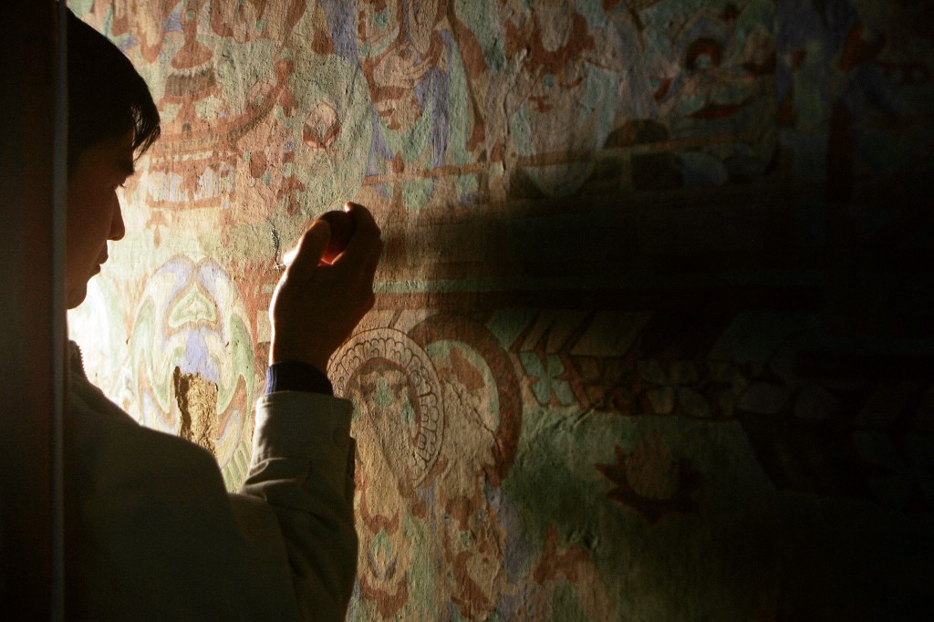 Des chercheurs japonais ont reproduit à l'identique une fresque bouddhiste détruite en 2001 par les talibans en Afghanistan, en utilisant un mélange de techniques traditionnelles et numériques. (Photo/AFP)
