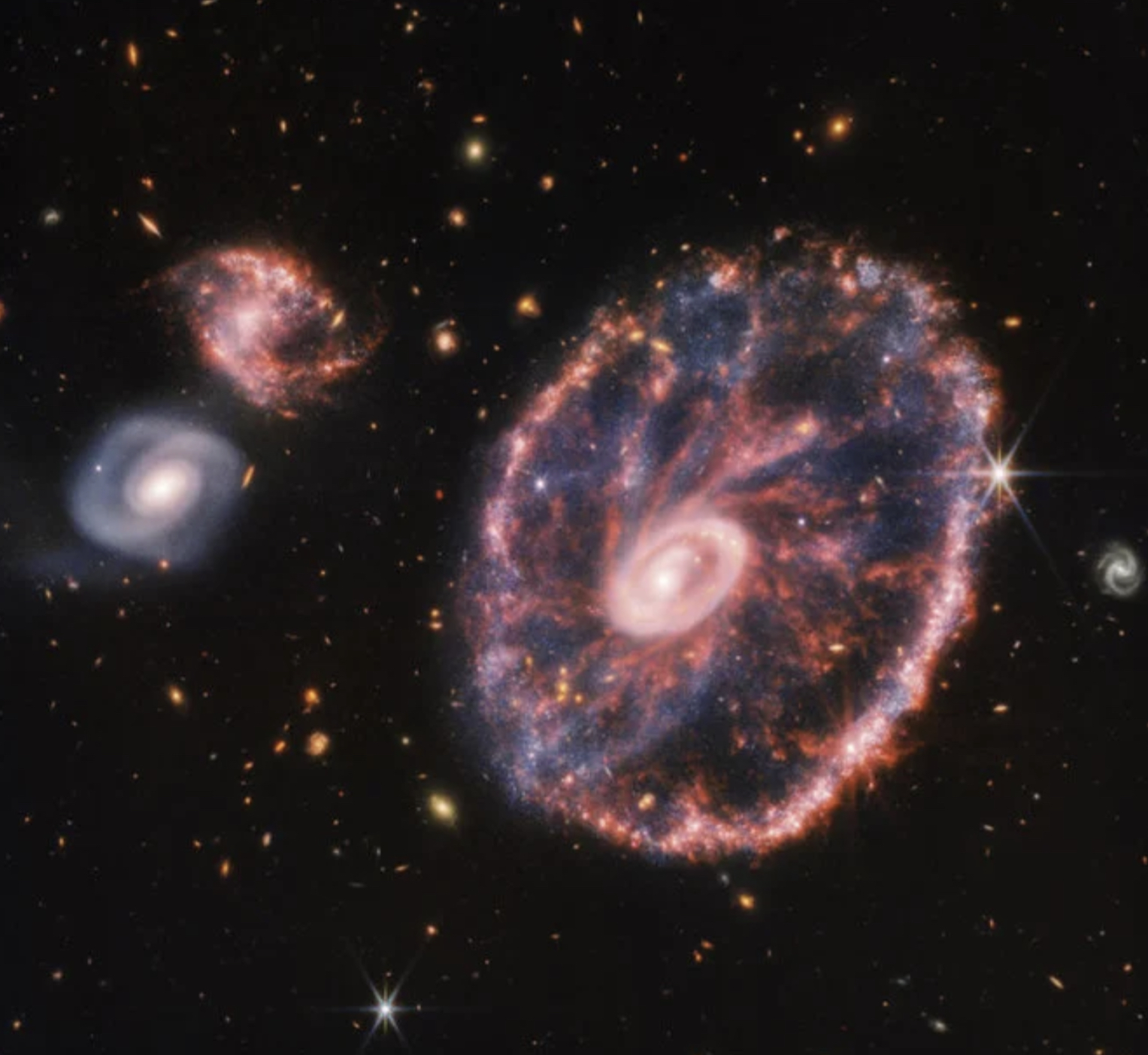 Le télescope James Webb révèle une spectaculaire image de la galaxie de la Roue de chariot