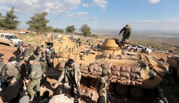 Les troupes turques et les combattants syriens pro-turcs essaient de prendre contrôle de la colline de Bursayah (AP)