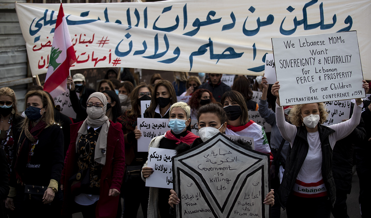 Protesters participate in a march against the political leadership they blame for the economic, financial crisis and 4 Aug. Beirut blast, in Beirut, Lebanon, Saturday, March 20, 2021. (AP)