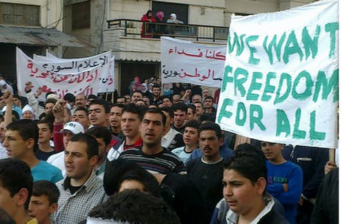 Syrian anti-government protesters march as part of an uprising against the country’s authoritarian regime, in Banias, Syria, April 17, 2011. (AP Photo)