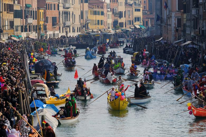 The masquerade parade on the Grand Canal during the Venice Carnival. (Reuters)