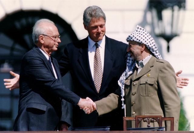 Yasser Arafat, Yitzhak Rabin and Bill Clinton after the signing of the Israeli-PLO peace accord, White House, Washington, U.S., Sept. 13, 1993. (Reuters)