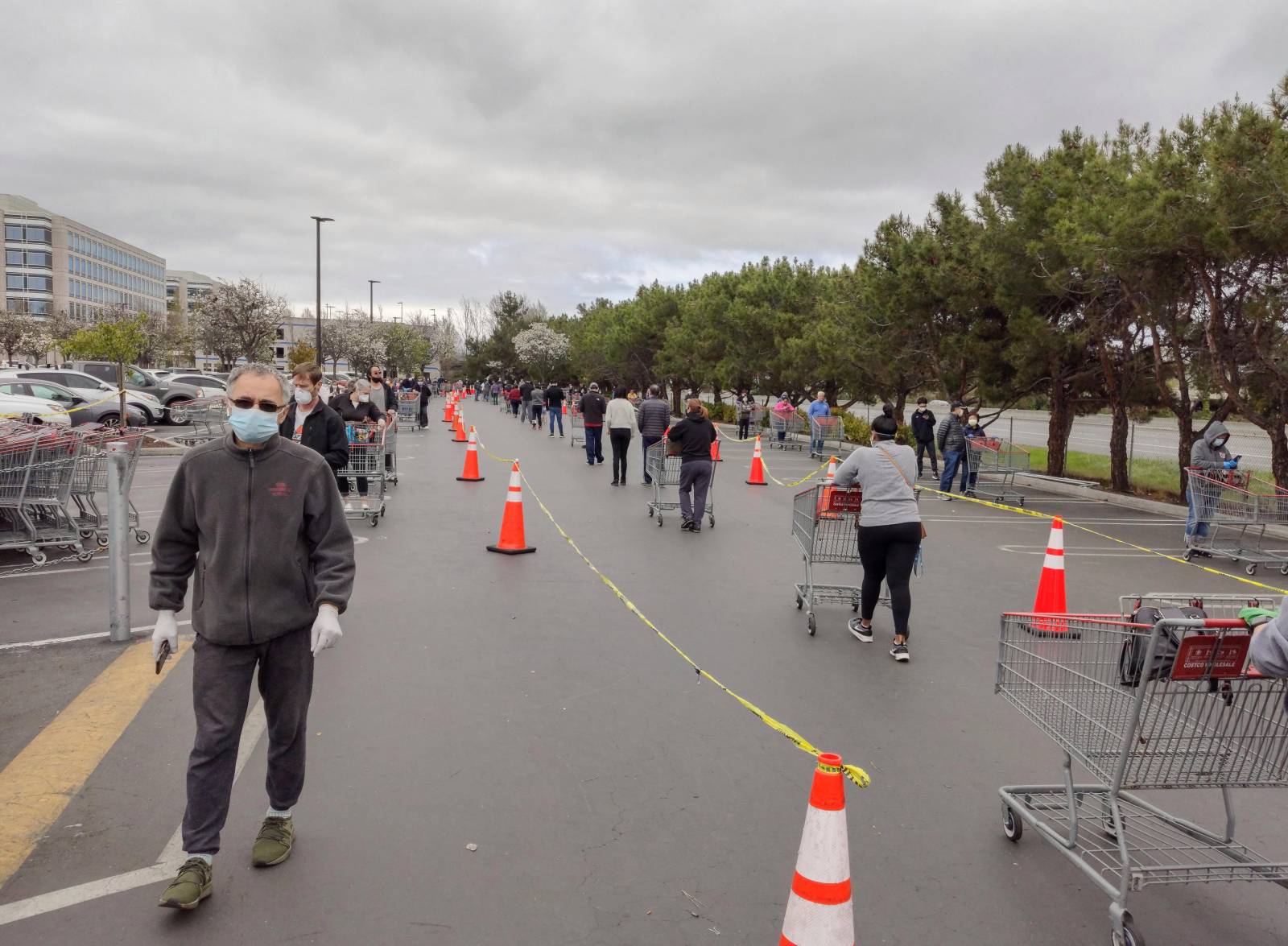 Shoppers keep their distance from one another as they wait to enter Costco in San Francisco, Calif., on April 8, 2020. (Getty Images)