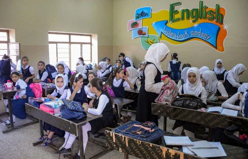 Iraqi schoolgirls attend an English class at a school in western Mosul. (AFP)