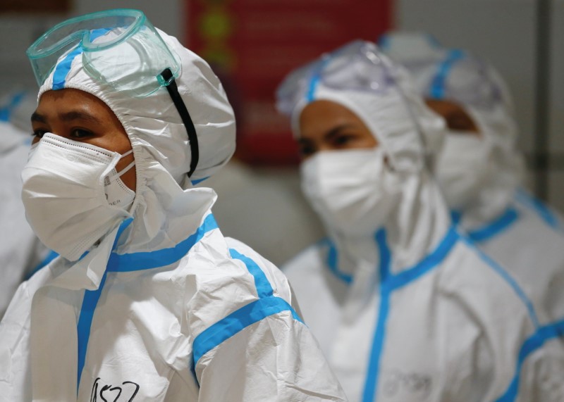 Healthcare workers get ready to treat patients at an emergency COVID-19 hospital, Jakarta, Indonesia, June 17, 2021. (Reuters)
